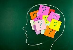 Head with questions on post-it notes