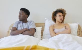 A couple having a disagreement, showing the same expressions