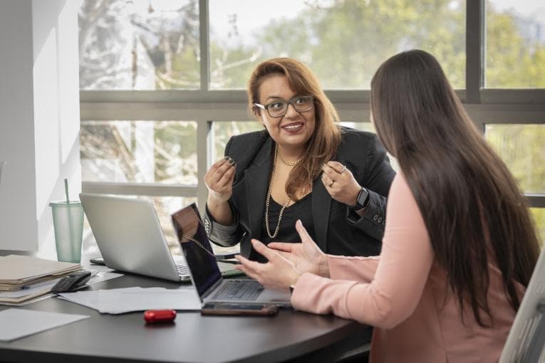 A mentor in conversation with her mentee