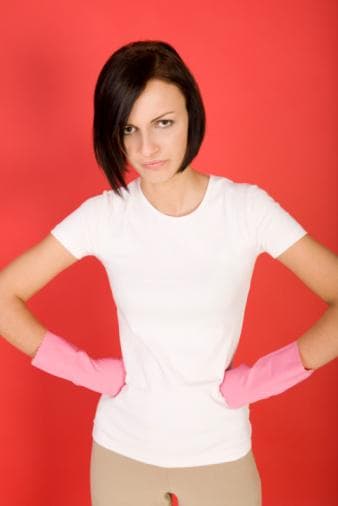 Woman hands akimbo with domestic work gloves on