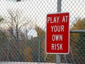 Play at your own risk signpost