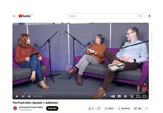 Dr Klara Price hosting the Psych Sofa podcast