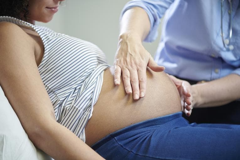 Pregnant person getting a scan