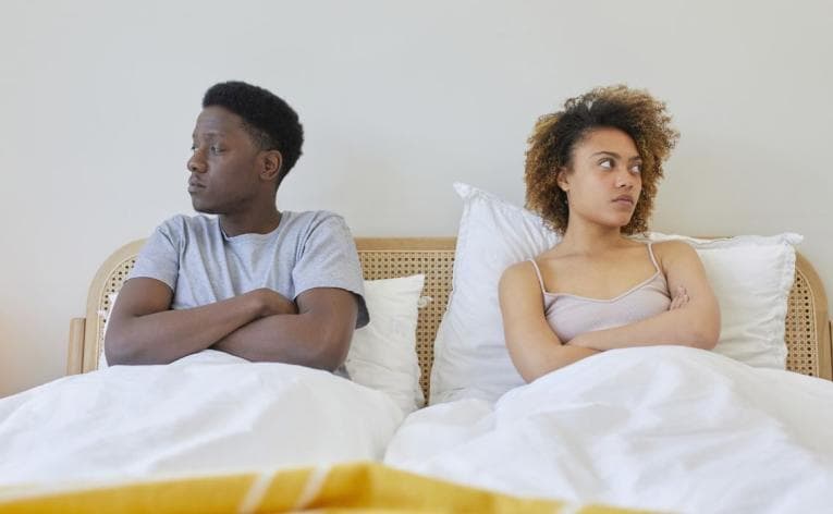 A couple having a disagreement, showing the same expressions